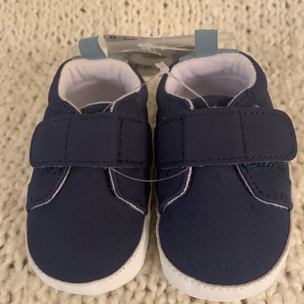 Carter’s dark blue infant shoes, 0 - 3 months.